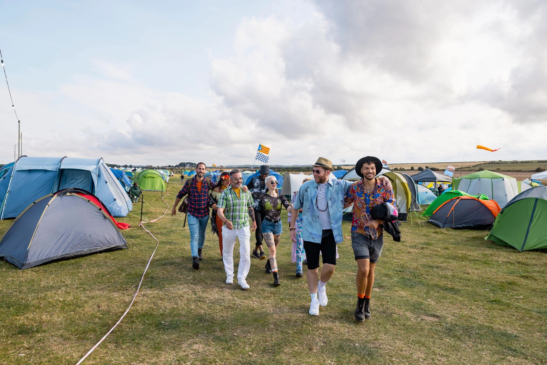 Festival crowd walking toward a music event