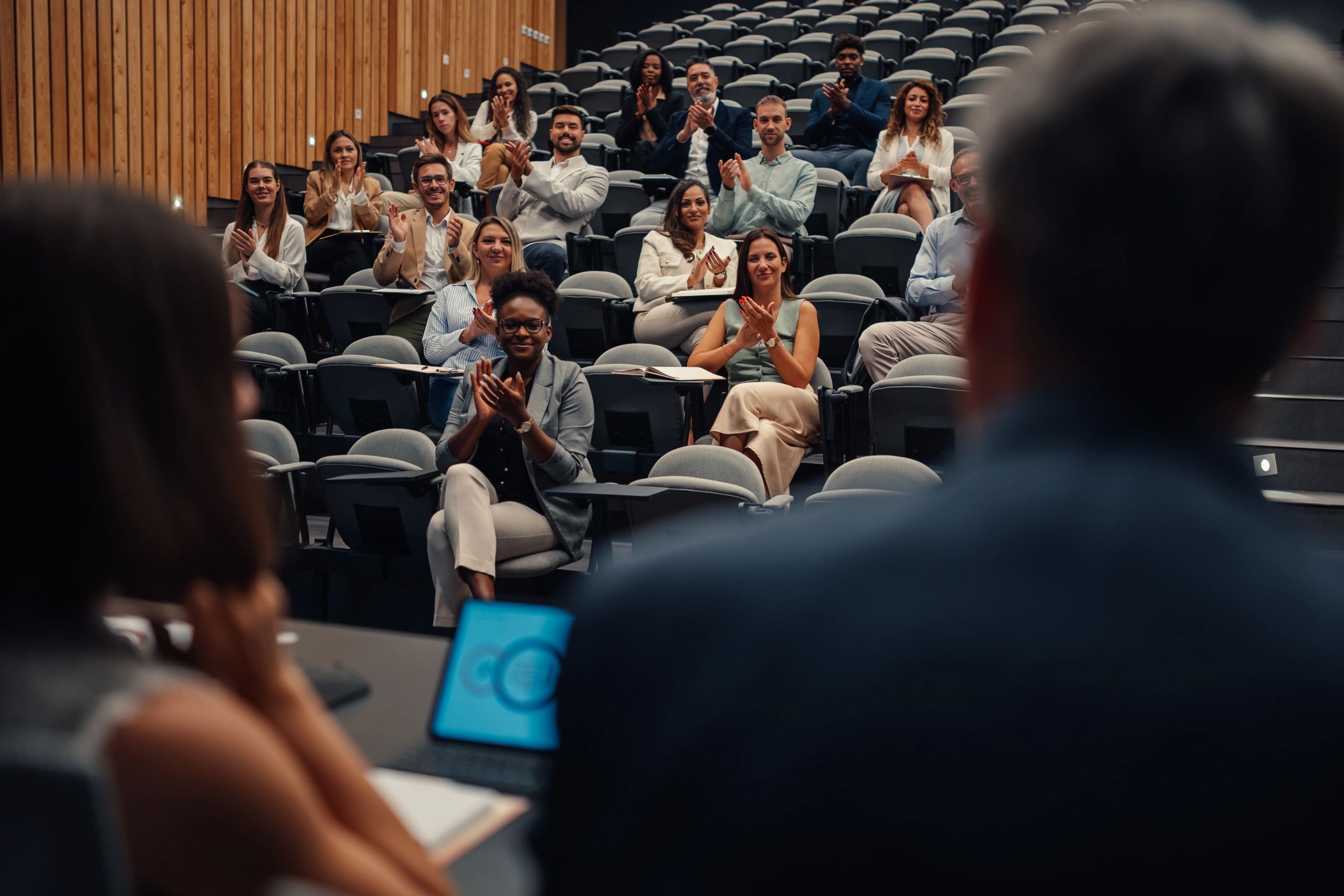 Public event audience representing influence, debate, and civic engagement