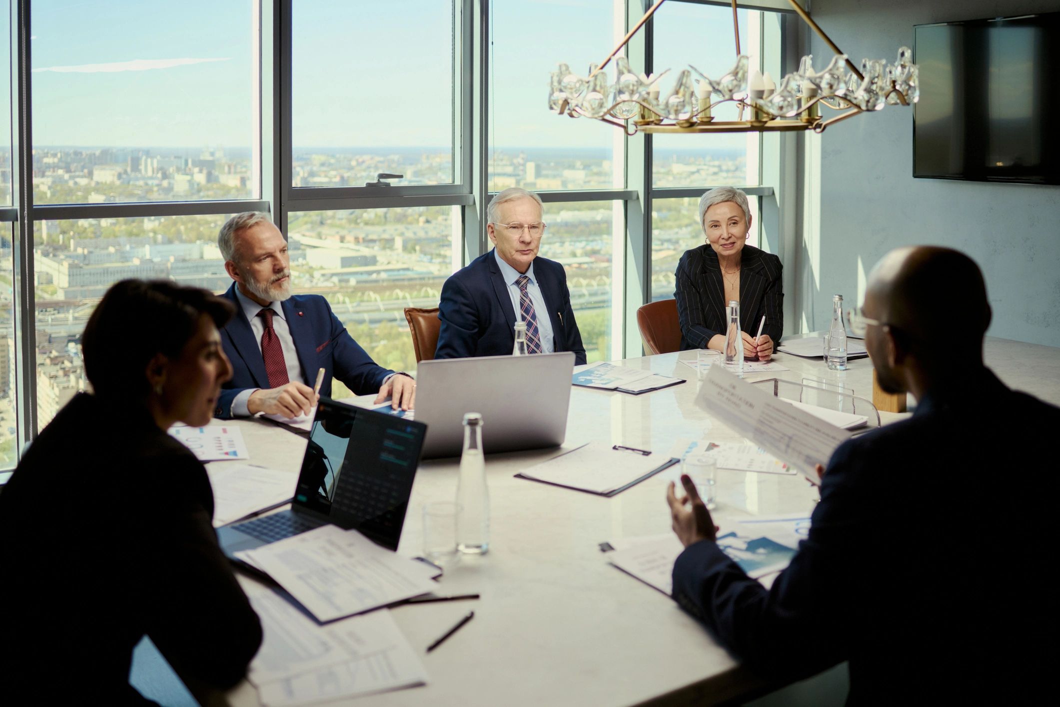Editorial team in discussion representing campaign and political strategy coverage