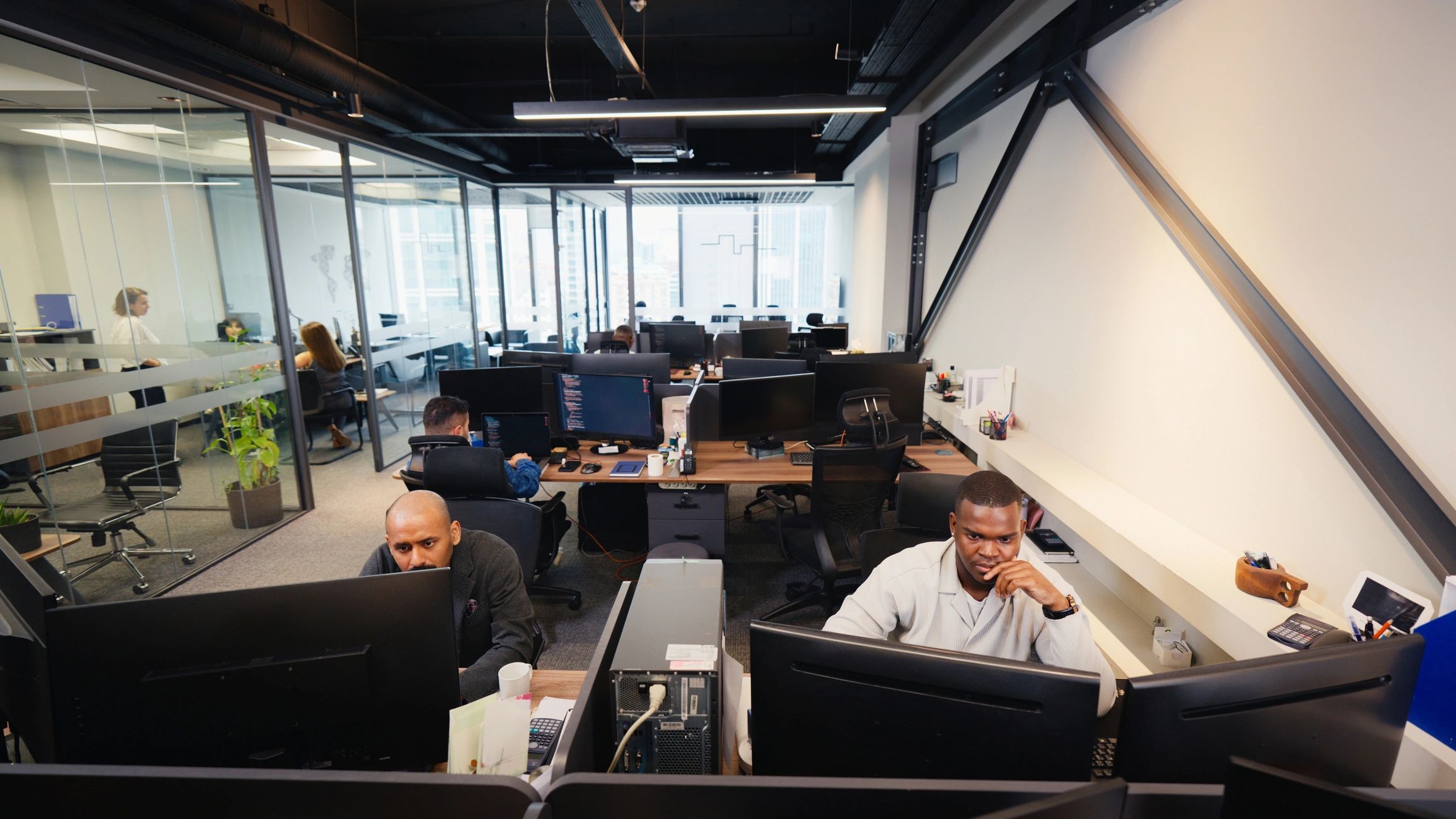Editorial team working in a modern newsroom